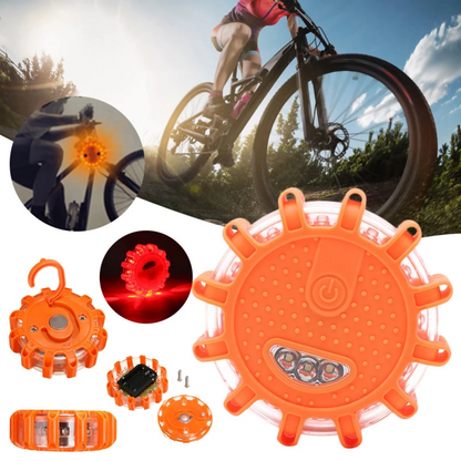 Orange LED safety light with multiple lighting modes, shown with biker and clear sky background.