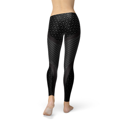 Black leggings with hexagonal and woven patterns, worn by a barefoot person from the back.