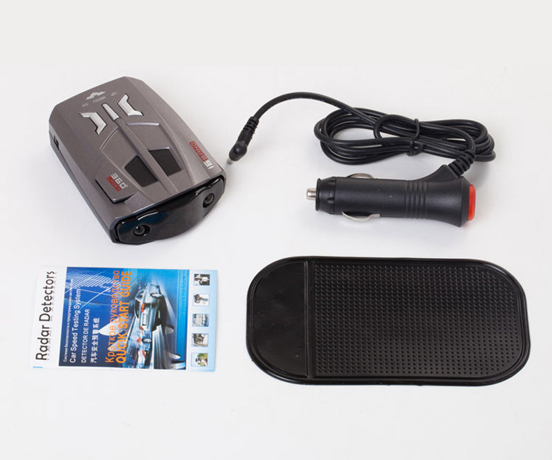 Gray radar detector, black car charger with red tip, black textured pad, and instruction leaflet.