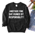Black sweatshirt with white text: “Another fine day ruined by responsibility.”