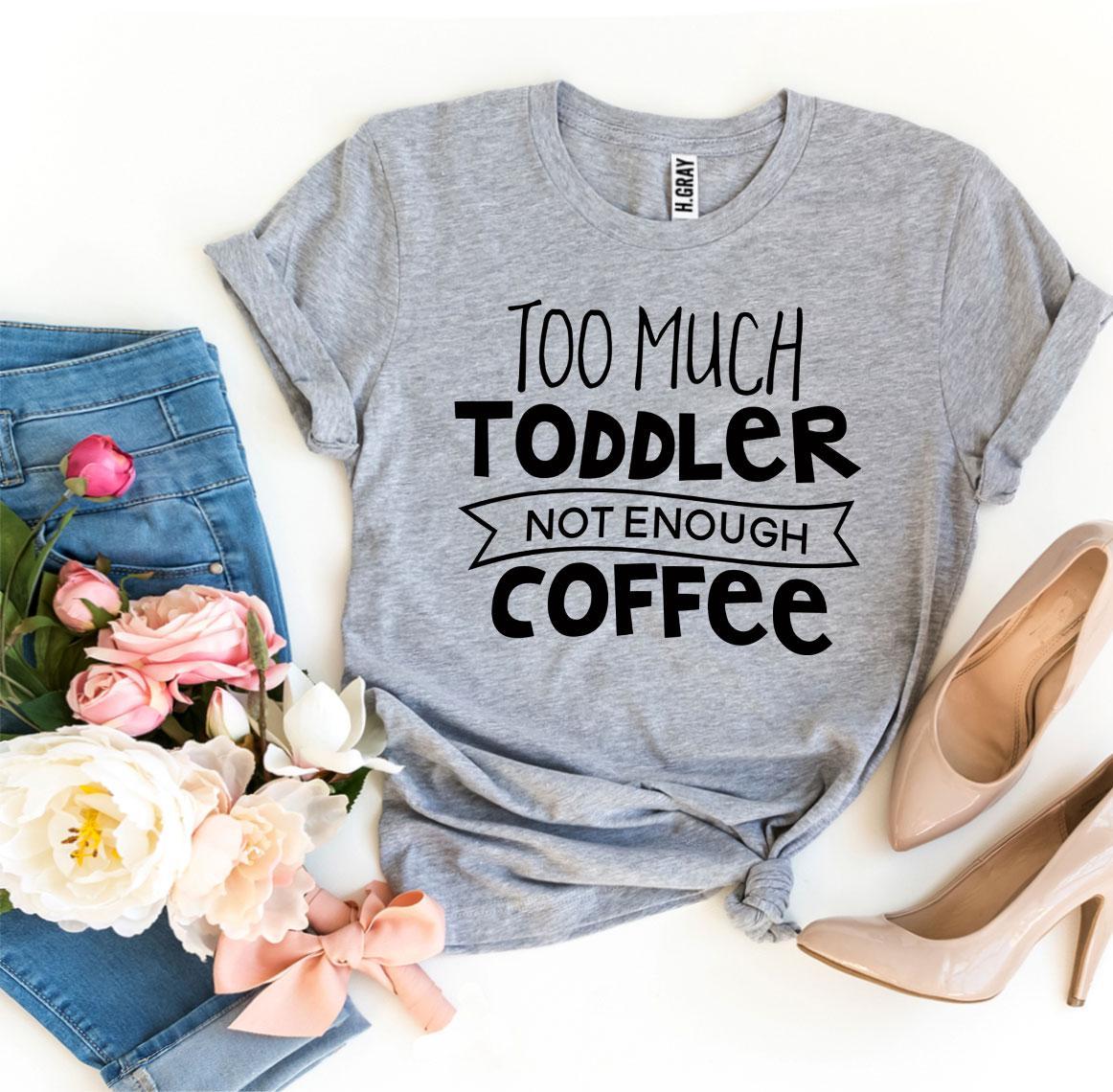 Gray t-shirt with "Too Much Toddler, Not Enough Coffee" text, jeans, flowers, and beige heels.