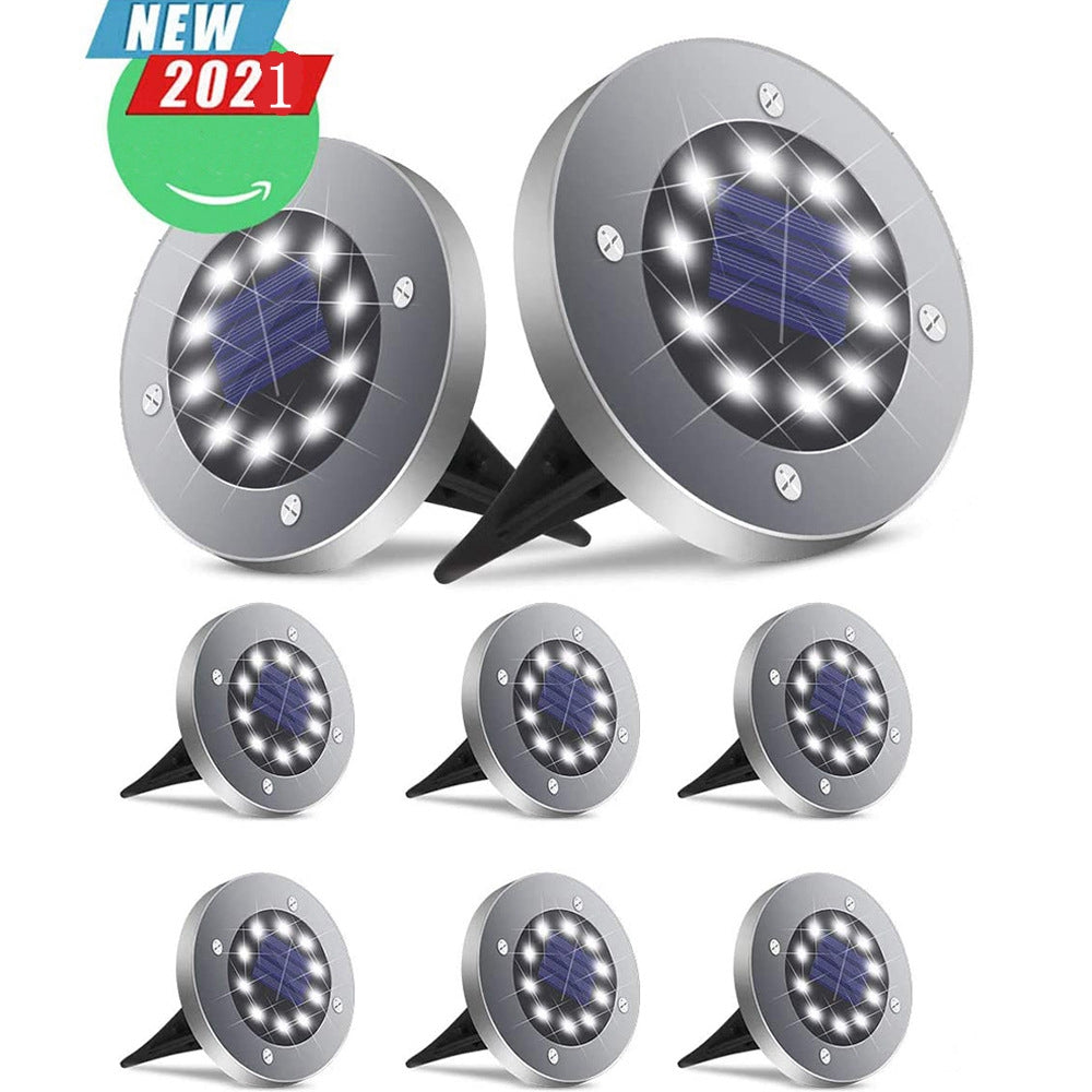 Silver solar LED lights with round discs and black stakes on a white background. "New 2021" badge.