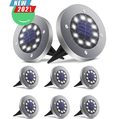 Silver solar LED lights with round discs and black stakes on a white background. "New 2021" badge.