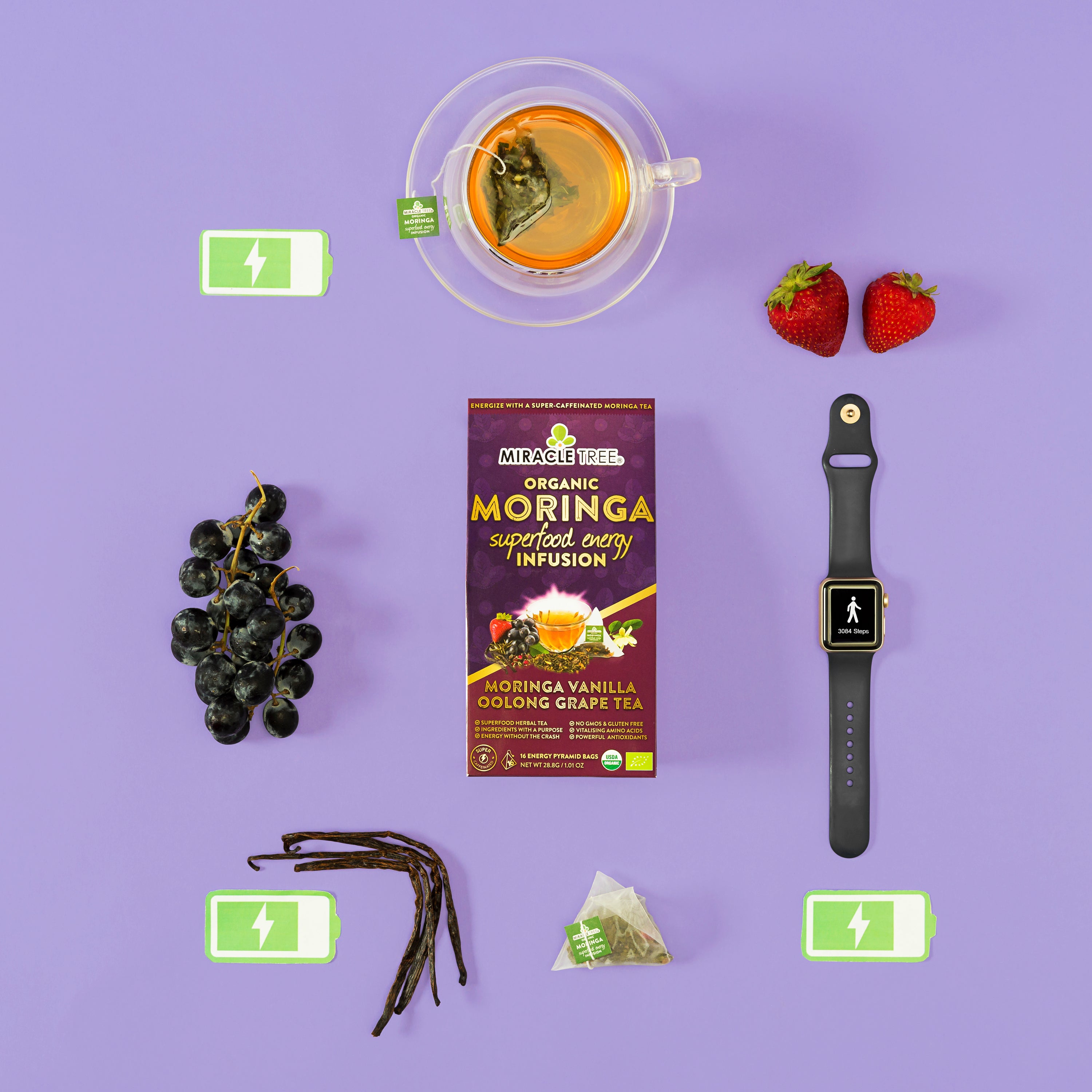 Tea box, cup, grapes, strawberries, vanilla pods, smartwatch, and battery icons on purple background.