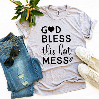 Gray T-shirt with "God Bless This Hot Mess" text, jeans, white sneakers, and sunglasses.