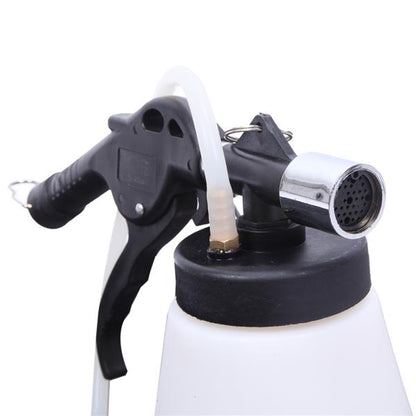 Black and white spray bottle with a metallic nozzle and a rubber hose connection.