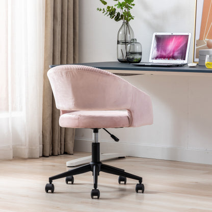 Pink office chair on wheels, beside a desk with a laptop, vases, and a plant. Bright room with curtains.