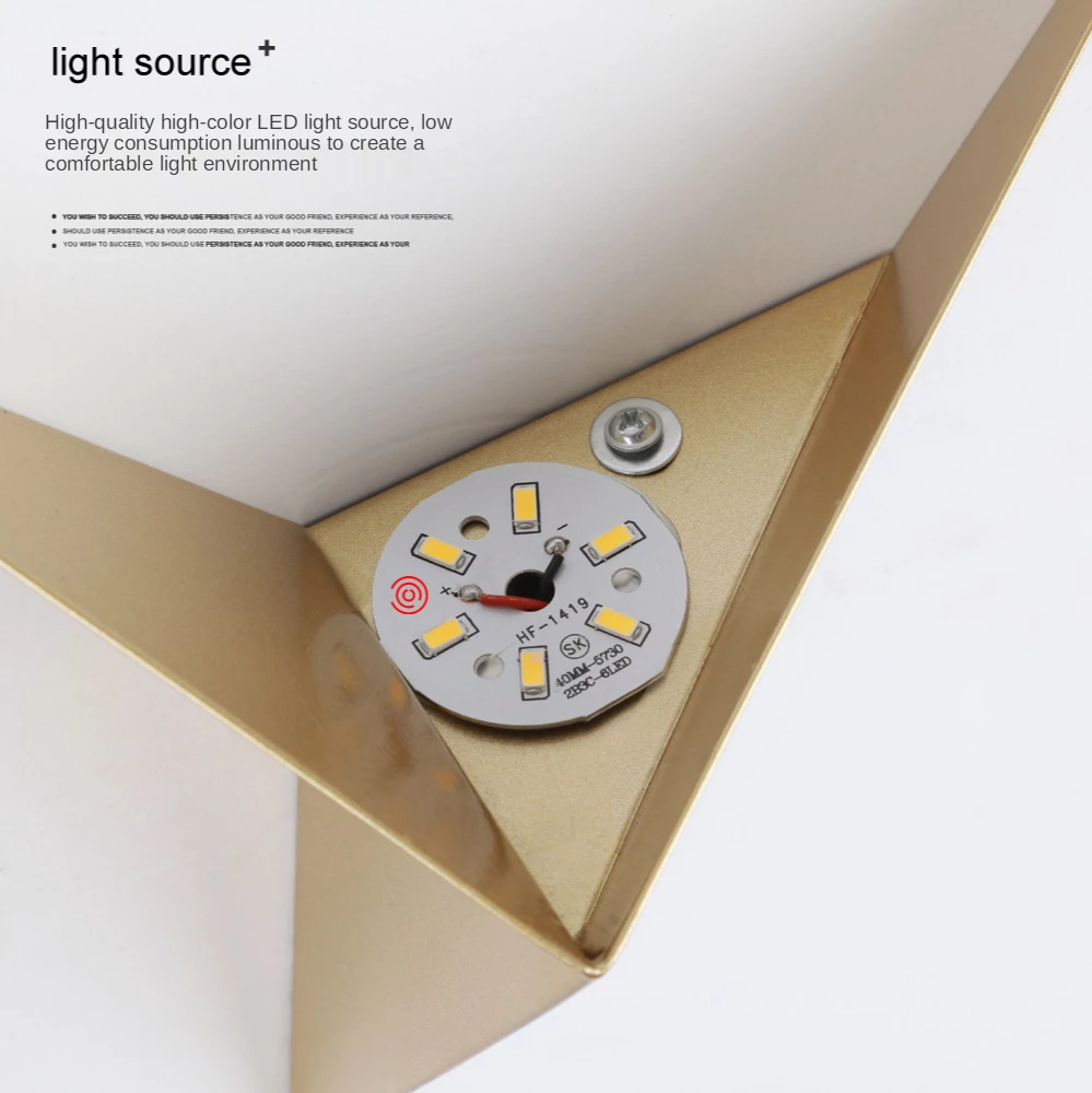 Close-up of LED light source in a gold triangular fixture, with visible screws and circuit details.