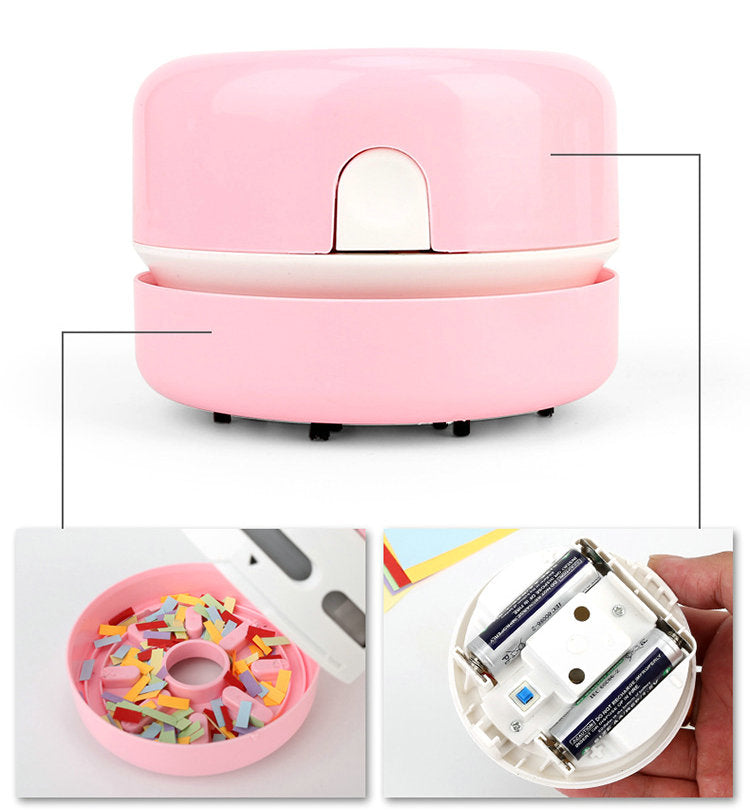 Pink tabletop vacuum with colorful confetti inside; bottom view shows battery compartment.