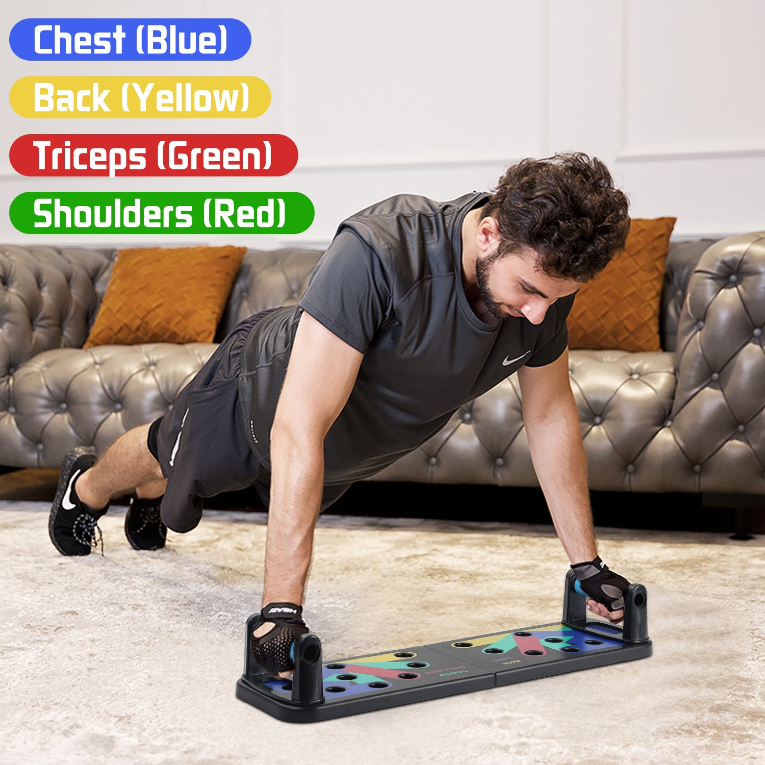 Man doing push-ups on multi-colored exercise board, with a gray couch in the background.