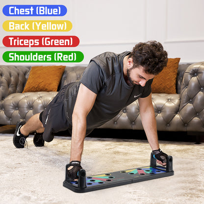 Man doing push-ups on multi-colored exercise board, with a gray couch in the background.