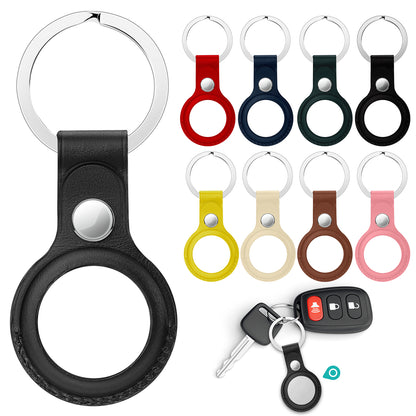 Colorful leather keychain cases and key set, featuring circular holders and sleek design.