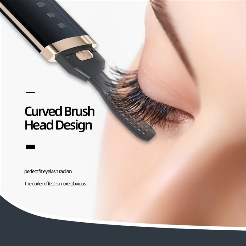 Curved brush head curls eyelashes; close-up view, sleek black and gold design.