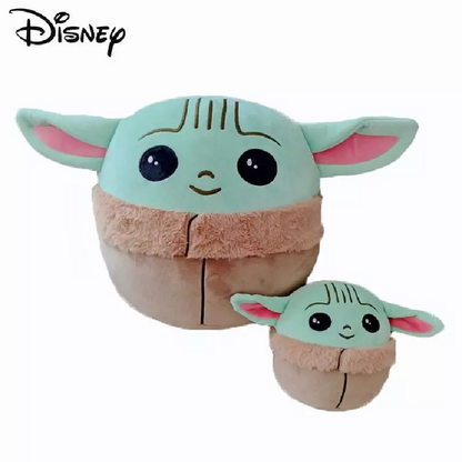 Green Baby Yoda plush toys in two sizes, with big eyes, pink ears, and brown robes.