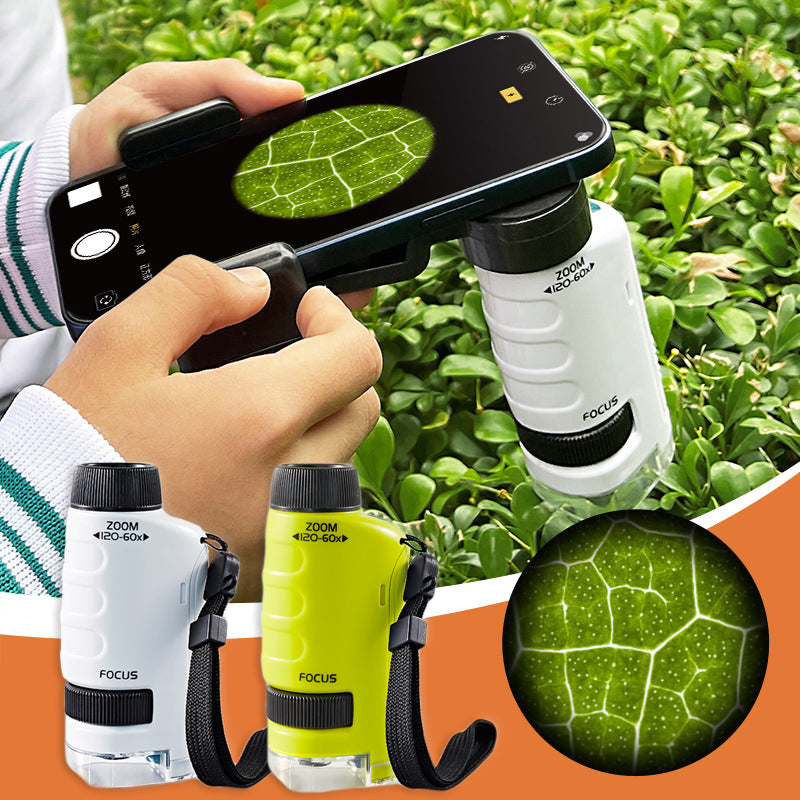 Hands holding a smartphone with a microscope, capturing a magnified leaf on a green bush.