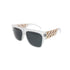 White-framed sunglasses with dark lenses and gold chain-like details on the arms.