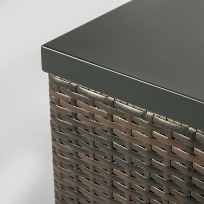 Close-up of a brown wicker box with a smooth dark gray top.