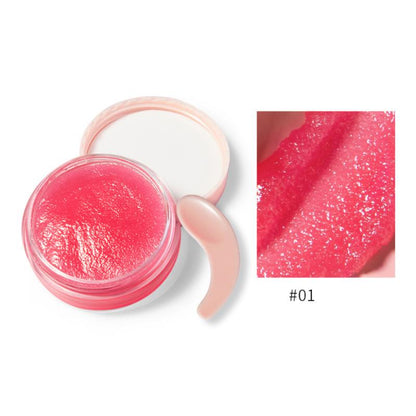 Open jar of glossy pink lip balm with a pink applicator; close-up shows glittery texture.
