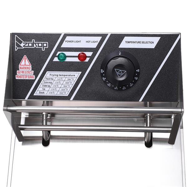 Control panel with black surface, green and red buttons, and a temperature dial.