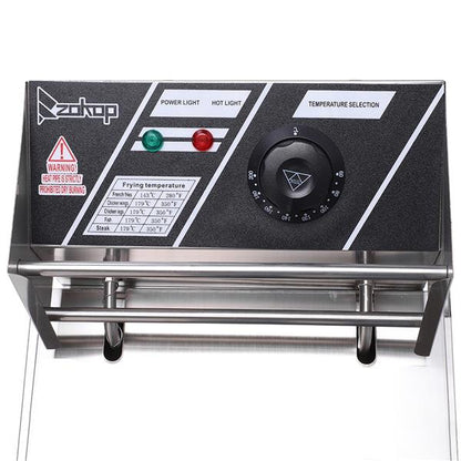 Control panel with black surface, green and red buttons, and a temperature dial.