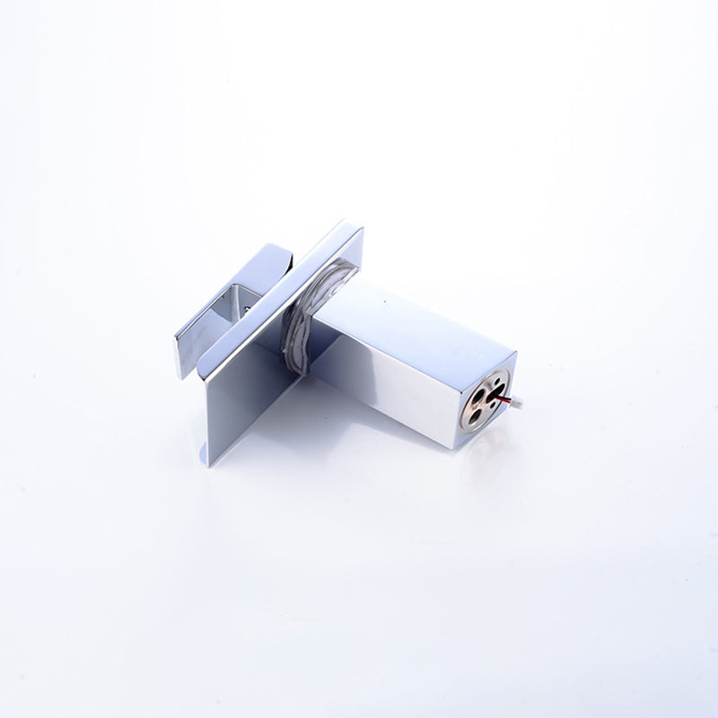 Silver metal faucet with a rectangular spout and handle, viewed on a white background.