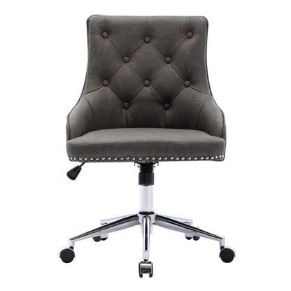 Gray, tufted office chair with button details, chrome base, and casters.
