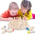 Children playing with a wooden board game featuring colored peg pieces on a white surface.