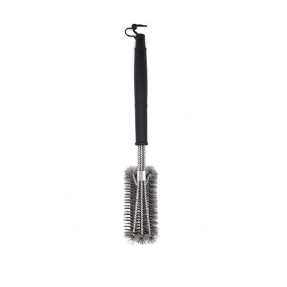 Black-handled grill brush with metal bristles and hanging loop on white background.