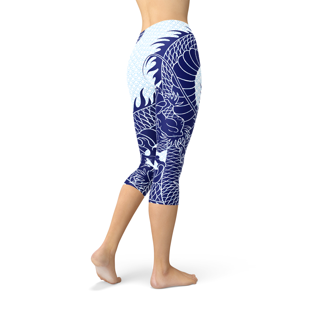 Blue dragon leggings with a white scale pattern, worn by a person standing barefoot.