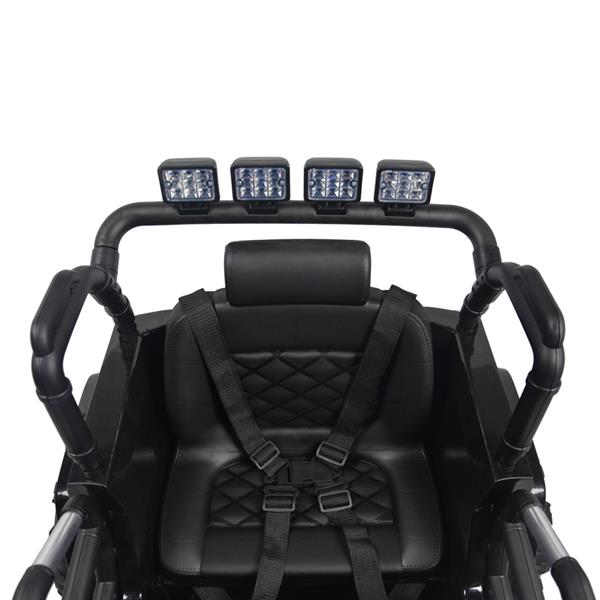 Black seat with diamond stitching, harness, and overhead LED lights on a bar frame.