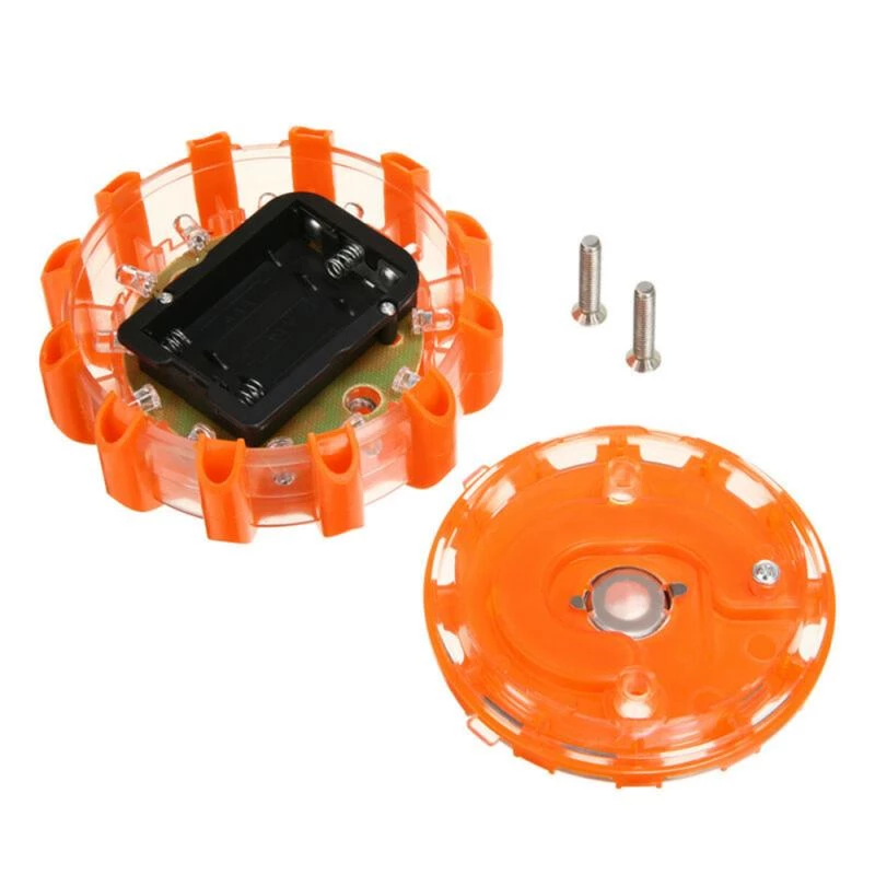 Orange safety light with a clear cover, black battery compartment, and two screws beside it.