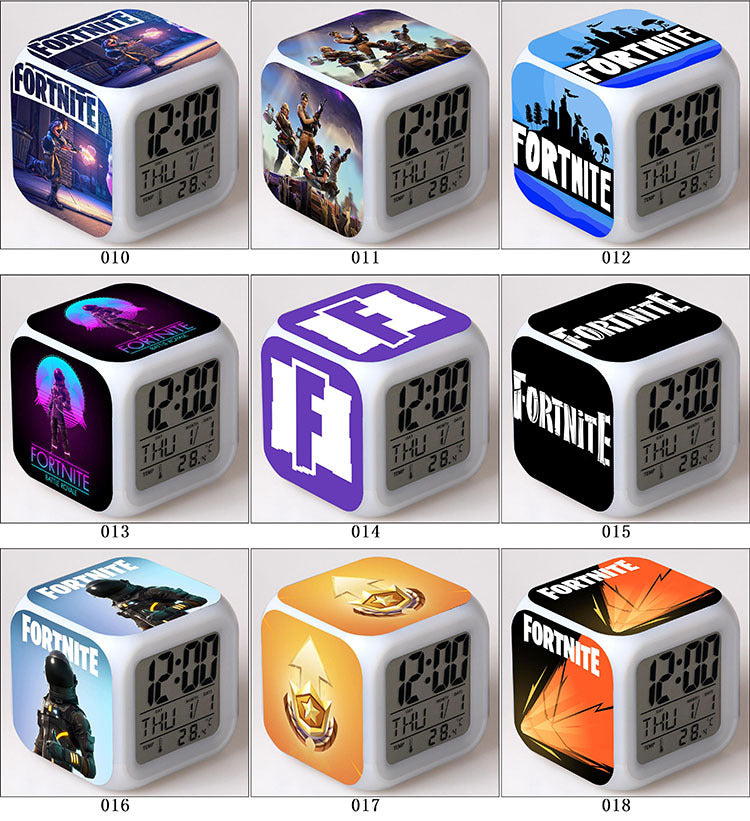 Cube-shaped clocks with Fortnite-themed designs, vibrant colors, and digital displays reading 12:00.