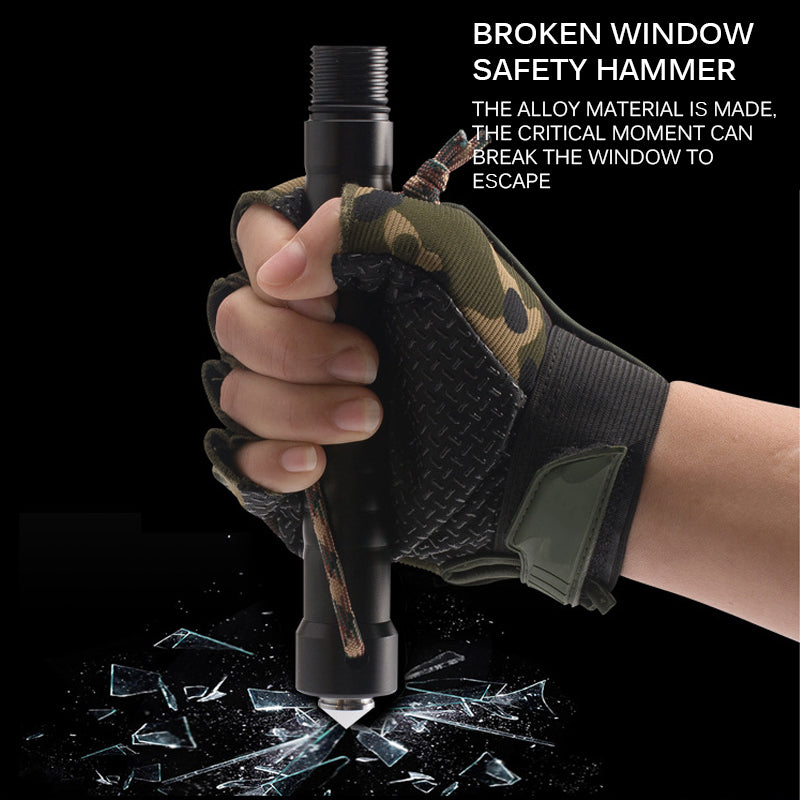 Hand in camo glove holding a black safety hammer, shattering glass on a dark background.