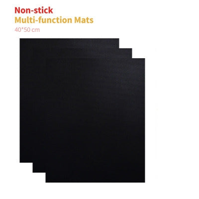 Three black, rectangular non-stick mats measuring 40x50 cm, with text above.