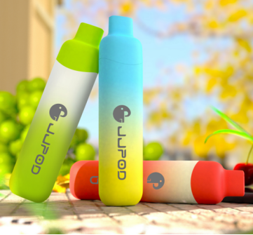 Colorful cylindrical containers with gradient designs, featuring blue, green, and red hues on a table.