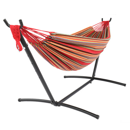Striped hammock with red, yellow, and green hues on a black metal stand.