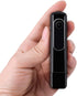 Hand holding a small, rectangular black camera device with a lens on the front.