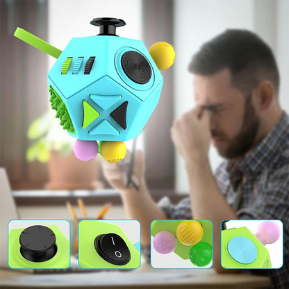Blue fidget cube with various buttons and textures against a person sitting at a desk.