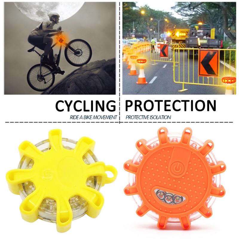Cyclist jumps under moonlight; road with cones. Yellow and orange safety lights shown below.