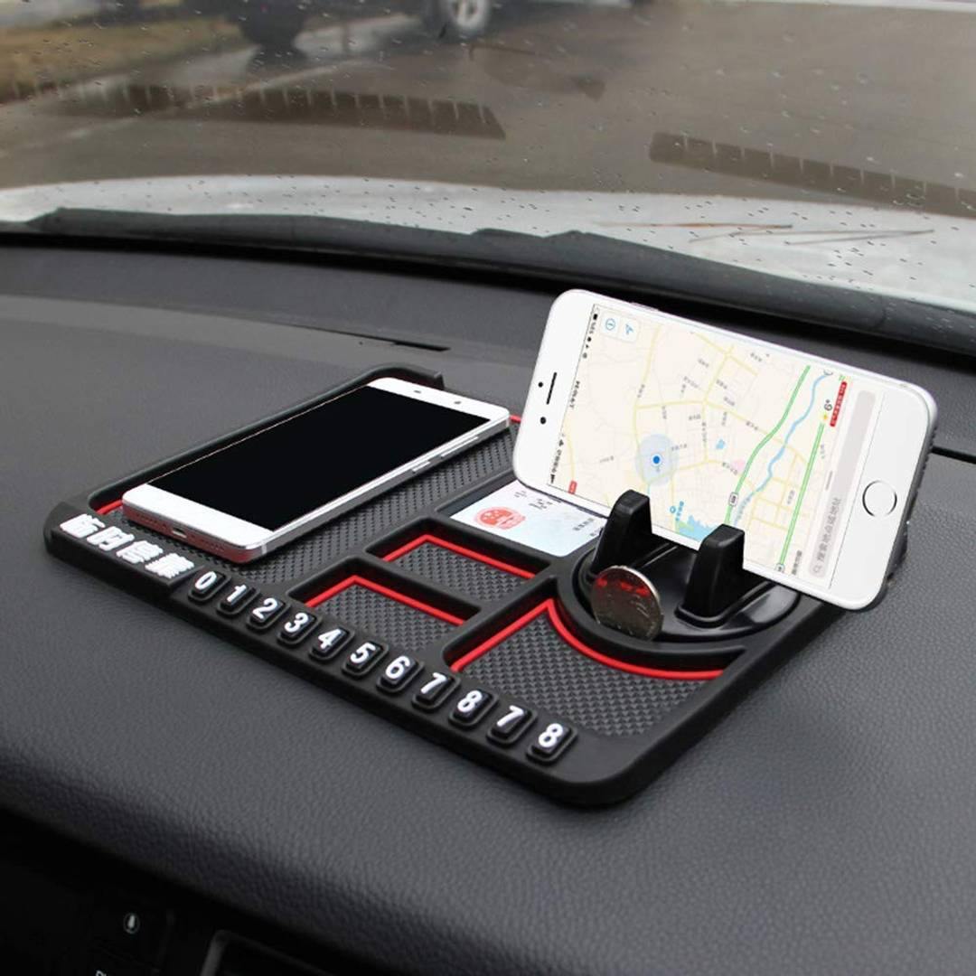 Car dashboard organizer with phone holder displaying a map, number keys, and card slots.