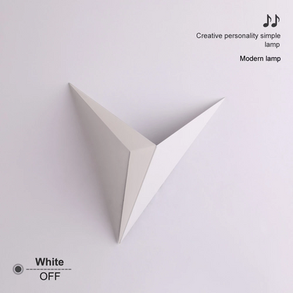 White, triangular wall-mounted lamp with clean, modern design on a light purple background.