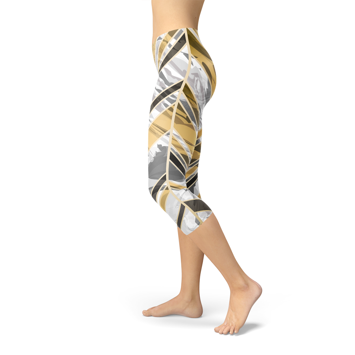Person wearing colorful leggings with abstract brown, gray, and yellow patterns, standing barefoot.