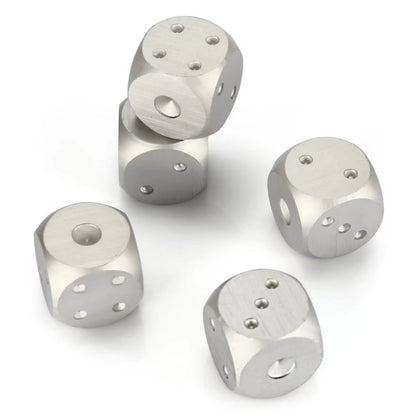 Five silver metal dice with rounded edges, showing various numbers.