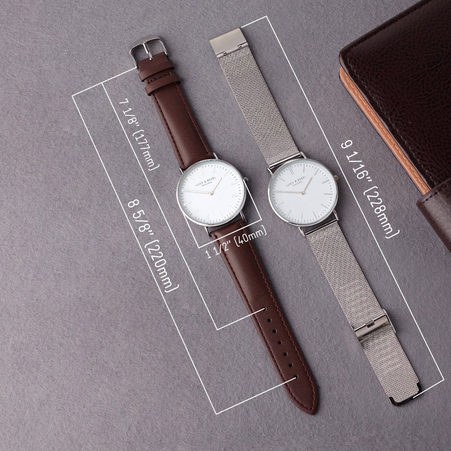 Two minimalist watches: one with a brown leather strap, the other with a silver mesh strap, on gray.