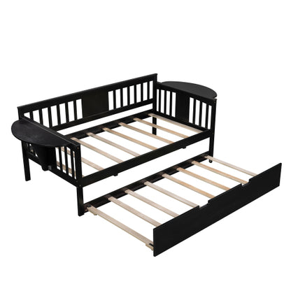 Black wooden daybed with a pull-out trundle, slatted frames, and curved armrests.