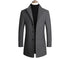 Gray overcoat with black buttons on a mannequin, featuring a black collarless top underneath.