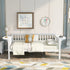 White daybed with plaid pillow, beige blanket, floral artwork, clock, and modern lamp on side tables.