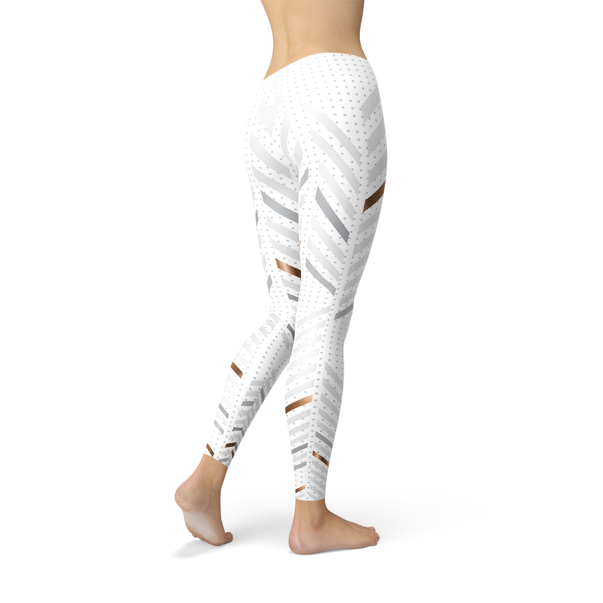 Person wearing white leggings with gray geometric patterns and brown accents, standing barefoot.