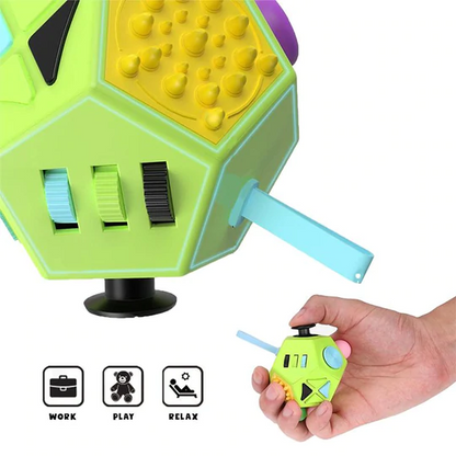 Green fidget cube with various textured buttons and switches; hand holding a smaller version.