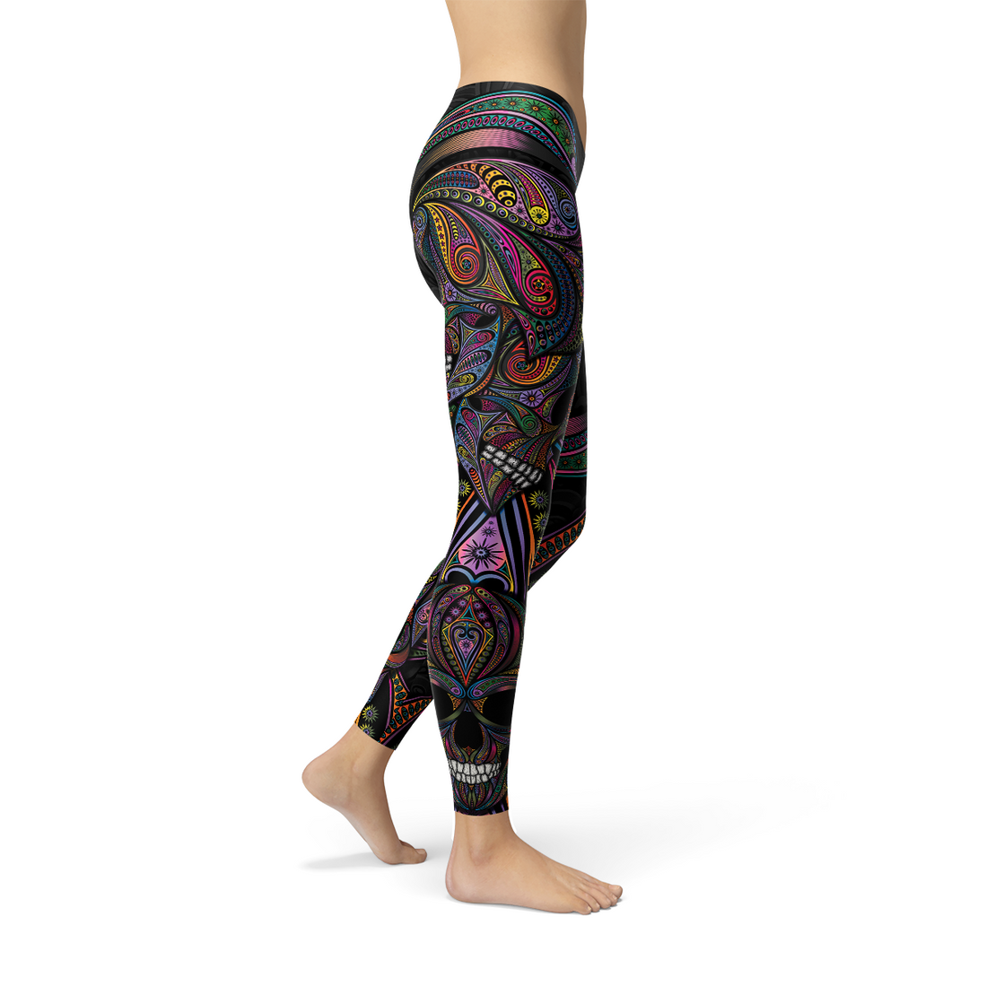 Colorful patterned leggings with intricate swirls and shapes on a person standing barefoot.